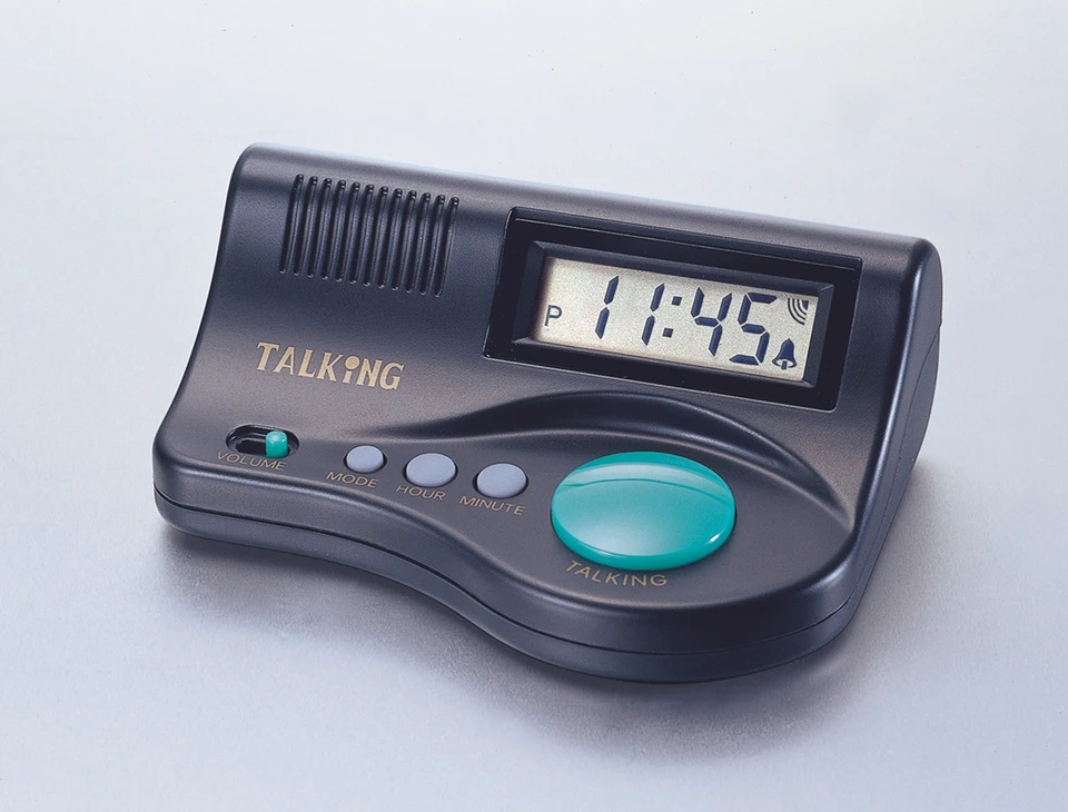 A black talking countdown timer with a curved wedge body: a digital display reading 11:45, a slotted speaker grille, a small volume switch, three small round buttons labeled MODE, HOUR, and MINUTE, and one very large teal-green oval button labeled TALKING.